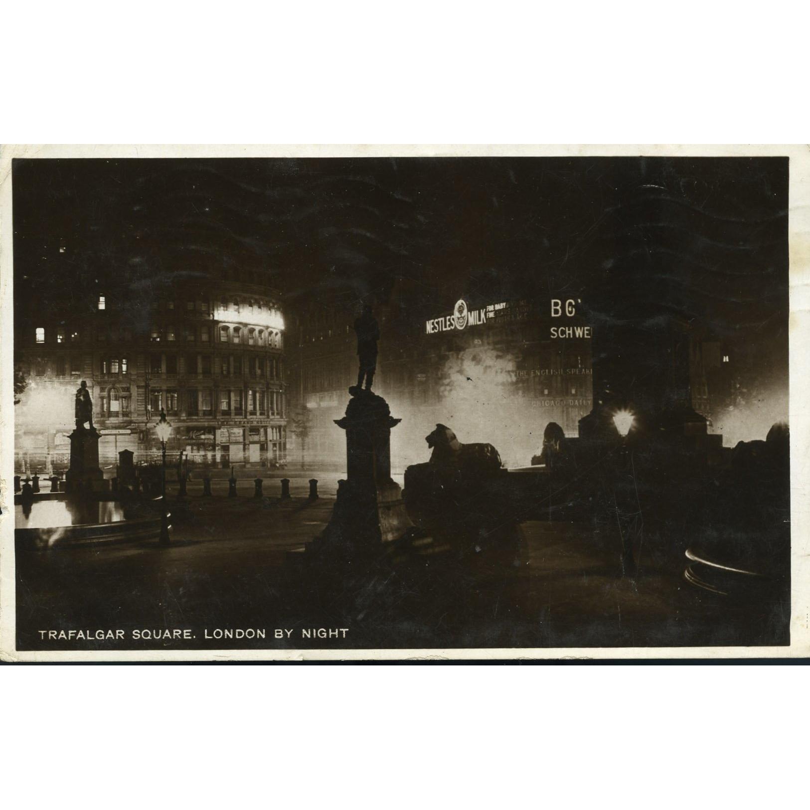 Real Photograph Postcard  'Trafalgar Square. London by Night'